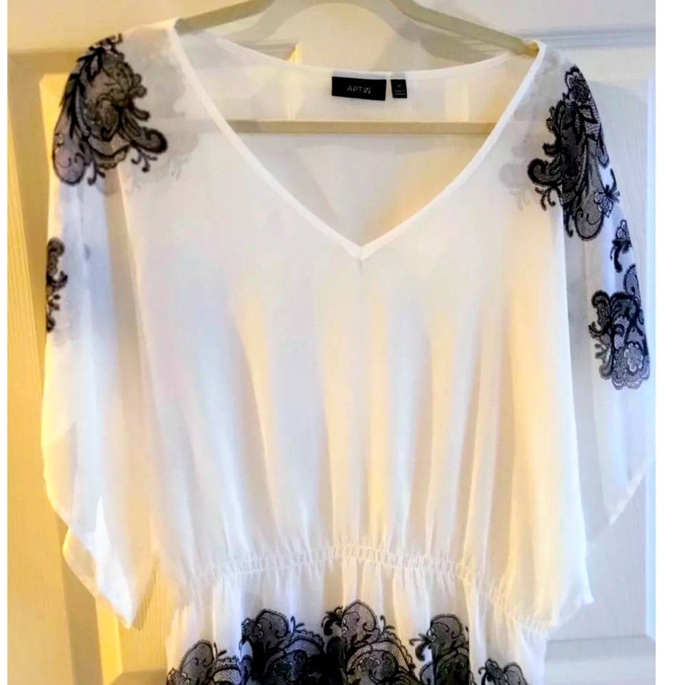 Elegant sheer flutter sleeve white M with black lace accents NWT